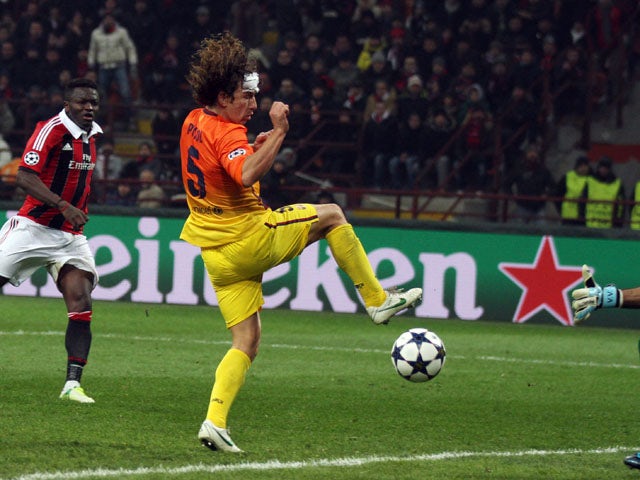 AC Milan's Sulley Muntari scores for his side against Barcelona in the Champions League round of 16 on February 20, 2013