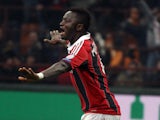 AC Milan's Sulley Muntari celebrates after scoring against Barcelona in the Champions League round of 16 on February 20, 2013