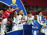 Swansea City players celebrate with the Capital One Cup trophy after defeating Bradford City in the final on February 24, 2013