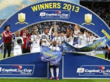 Swansea City players celebrate with the Capital One Cup trophy on February 24, 2013