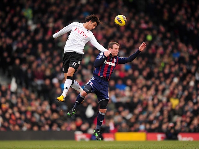 Fulham's Bryan Ruiz battle with Stoke's Glenn Whelan during a game on February 23, 2013