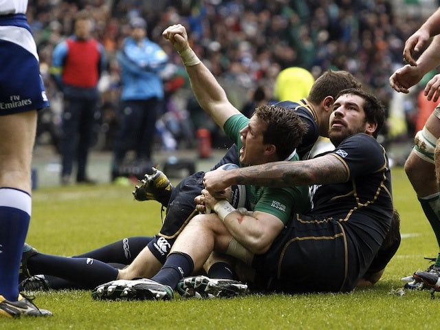 Ireland's Craig Gilroy celebrates scoring a try against Scotland on February 24, 2013