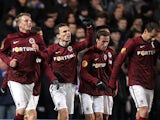 Sparta Prague's David Lafata celebrates with team mates after scoring the opening goal against Chelsea on February 21, 2013