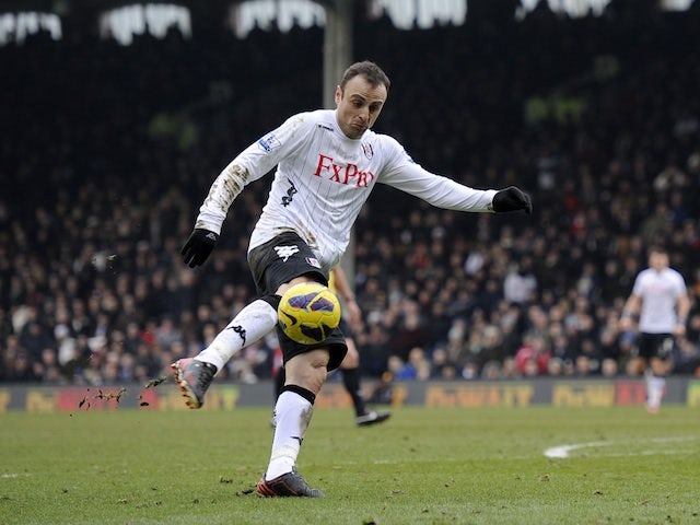 Fulham forward Dimitar Berbatov scores against Stoke on February 23, 2013