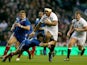 England's Manu Tuilagi is tackled by France's Morgan Parra during the RBS Six Nations match on February 23, 2013