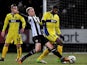 Notts County's Neal Bishop and Bury's Ethan Ebanks-Landell battle for the ball on February 22, 2013