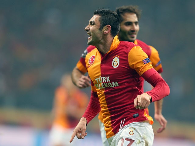 Galatasaray's Burak Yilmaz celebrates scoring for his team against Shalke on February 20, 2013