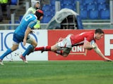 Alex Cuthbert scores a try for Wales in their match with Italy on February 23, 2013