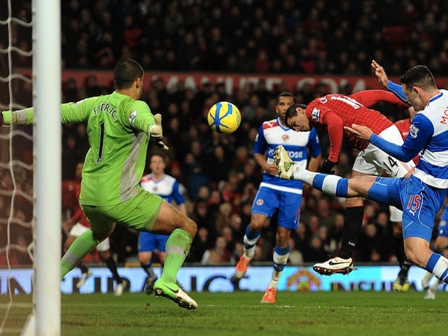 United striker Javier Hernandez heads the second goal against Reading on February 18, 2013