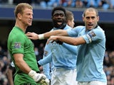 City players congratulate Joe Hart after his penalty save against Chelsea on February 24, 2013