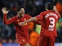 Liverpool's Luis Suarez celebrates with team mate Jose Enrique after scoring his team's third against Zenit St Petersburg on February 21, 2013