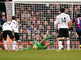 Fulham 'keeper Mark Schwarzer saves a penalty from Stoke's John Walters on February 23, 2013