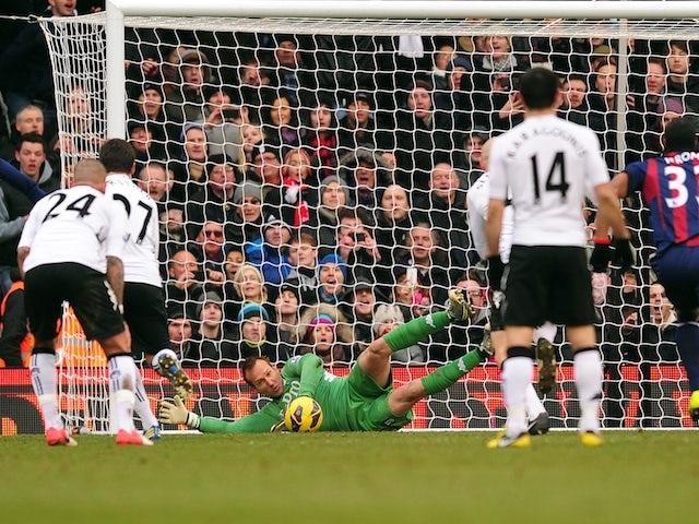 Fulham 'keeper Mark Schwarzer saves a penalty from Stoke's John Walters on February 23, 2013