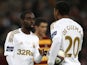 Swansea players Nathan Dyer and Jonathan de Guzman discuss who is to take the penalty after one is awarded in the game with Bradford on February 24, 2013