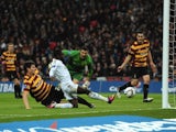Swansea winger Nathan Dyer slides home the opening goal in the Capital One Cup final against Bradford on February 24, 2013