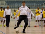 Deputy Prime Minister Nick Clegg kicks a ball during a visit to Brazil on June 21, 2012