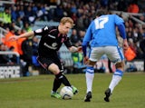 Birmingham City's Chris Burke tries to get past Peterborough United's Joe Newell on February 23, 2013