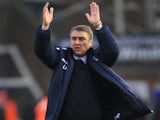 Birmingham manager Lee Clark applauds the travelling fans after his side's win against Peterborough on February 23, 2013