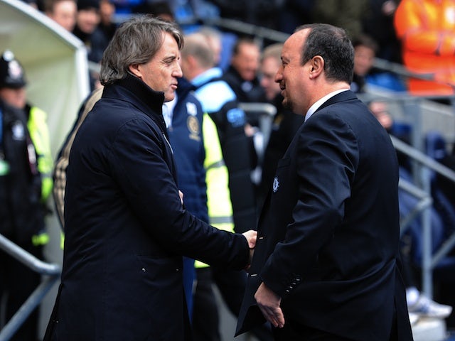 Opposing bosses Roberto Mancini and Rafa Benitez shake hands before the Man City v Chelsea match on February 24, 2013