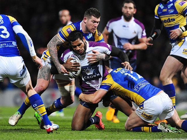 Melbourne Storm's Sisa Waqa is tackled by Leeds Rhino's Brett Delaney on February 22, 2013