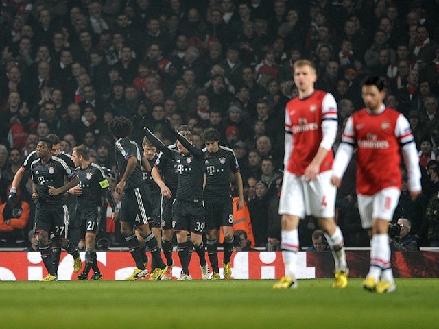 Bayern players celebrate after Toni Kroos gives them a 1-0 lead over Arsenal on February 19, 2013