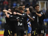 Players of Wigan Athletic celebrate a goal by Aruna Kone against Reading on February 23, 2013