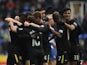 Players of Wigan Athletic celebrate a goal by Aruna Kone against Reading on February 23, 2013