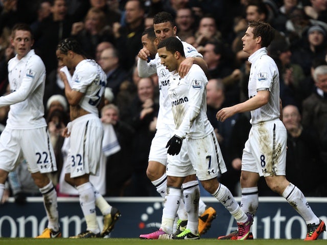 Spurs players congratulate Aaron Lennon after he put them 2-0 up against Arsenal on March 3, 2013