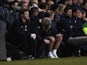 Arsenal manager Arsene Wenger sits in the dugout as his team lose 2-1 to Spurs on March 3, 2013