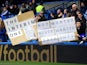 Fans hold up banners regarding Chelsea interim manager Rafael Benitez before their match with West Bromwich Albion on March 2, 2013