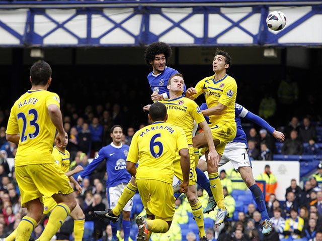 Everton's Marouane Fellaini scores the opening goal in his side's match against Reading on March 2, 2013