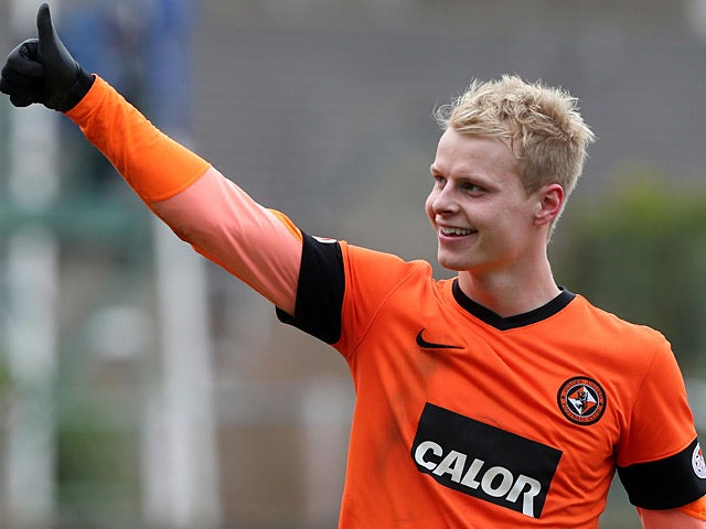 Dundee United's Gary MacKay-Steven celebrates his team's win after the final whistle in the Scottish Cup quarter final against rivals Dundee on March 3, 2013