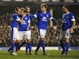 Everton's Leighton Baines is congratulated by team mates after scoring his team's second in the FA Cup 5th round replay against Oldham on February 26, 2013