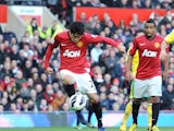 Manchester United's Shinji Kagawa shoots to score the opening goal against Norwich on March 2, 2013