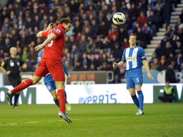 Liverpool's Stewart Downing scores for his side in their game against Wigan on March 2, 2013