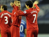 Liverpool's Luis Suarez celebrates scoring his first goal against Wigan on March 2, 2012