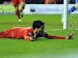 Luis Suarez celebrates scoring a hat-trick for Liverpool in their match against Wigan on March 2, 2013