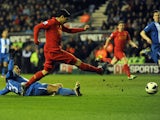Liverpool's Luis Suarez scores his hat-trick goal against Wigan on March 2, 2013