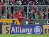 Bayern Munich's Jerome Boateng celebrates after scoring his side's third goal in their match with Fortuna Duesseldorf on March 9, 2013