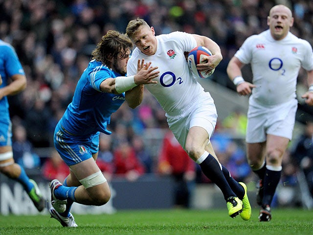 England's Chris Ashton is tackled by Italy's Joshua Furno on March 10, 2013