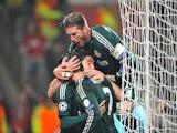 Real Madrid's Cristiano Ronaldo is congratulated by team mates after scoring against Manchester United on March 5, 2013