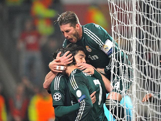 Real Madrid's Cristiano Ronaldo is congratulated by team mates after scoring against Manchester United on March 5, 2013