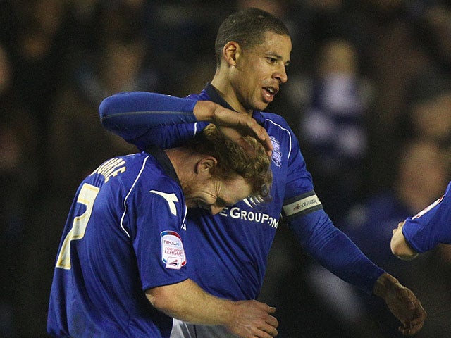 Birmingham's Curtis Davies celebrates with team mate Chris Burke after scoring the opener against Blackpool on March 5, 2013