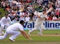 New Zealand's Hamish Rutherford hits a shot past England's Alastair Cook on March 8, 2013