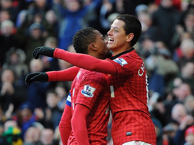 Javier Hernandez is congratulated by team mate Patrice Evra after scoring the opening goal against Chelsea in the FA Cup quarter final on March 10, 2013