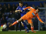 Birmingham City's Jonathan Spector and Blackpool's Angel Martinez battle for the ball on March 5, 2013