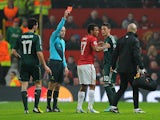 Manchester United's Nani is shown a red card during the second half against Real Madrid on March 5, 2013