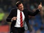 Cardiff boss Malky Mackay gestures to his team during the match against Derby on March 5, 2013