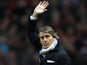 Manchester City manager Roberto Mancini waves during his side's FA Cup match with Barnsley on MArch 9, 2013