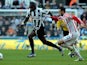 Moussa Sissoko and Marc Wilson battle for the ball on March 10, 2013